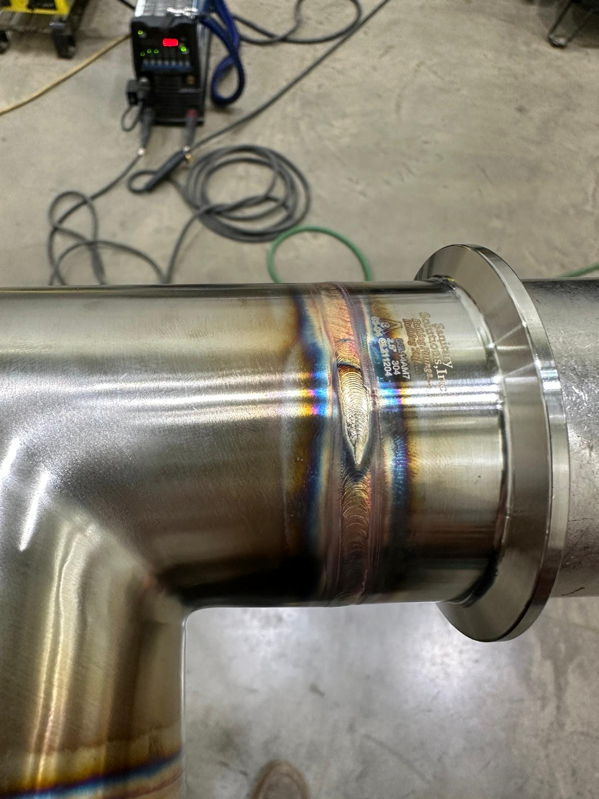 Close detail of a clean welded pipe joint — skilled trade work by D&P Universal